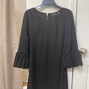 Gorgeous black dress with puff sleeves. Size Medium. Zipper on back.